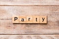 PARTY word written on wood block. PARTY text on wooden table for your desing, concept