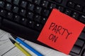 Party ON write on sticky notes isolated on Wooden Table