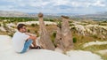 happy young men on vacation in Turkey Cappadocia, Rock Formations in Pasabag Monks Valley, Cappadocia, Turkey Royalty Free Stock Photo