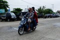 Kutai Barat  Indonesia - December 28  2020: Families riding motorbikes in the street market and many people Royalty Free Stock Photo