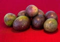 Pasiflora fruits on red cloth napkin