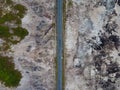Aerial top down view of road scenery in deforested and forest area. Royalty Free Stock Photo