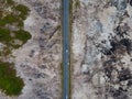 Aerial top down view of road scenery in deforested and forest area. Royalty Free Stock Photo
