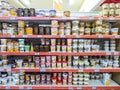 Supermarket shelves with a variety of dulce de leche of different brands - Argentina