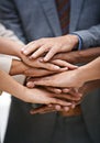 We pass our success from one to another. a group of businesspeople putting their hands together in unity. Royalty Free Stock Photo