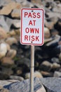 Pass at Own Risk Signage