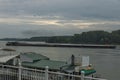 Pass tug-boat along pontoon and boats in the Vidin Danube port, Bulgaria