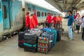 Tour guide directing porters at a Chandigarh Station