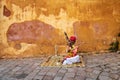 Musician outside the Moon Gate of the Amber, Fort Amer , Rajasthan, India Royalty Free Stock Photo