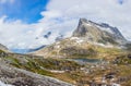 Passage in the mountains with snowy peaks around Alnesvatnet lake panorama, path of trolles, Trollstigen, Rauma Municipality, More