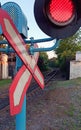 The passage is prohibited. Forbidding red traffic light and warning sign 1.3.1 Single-track railway near the place of train path Royalty Free Stock Photo