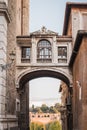 Passage under an old Roman bridge leading to the ruins of Rome Royalty Free Stock Photo