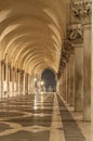 Passage way with columns of the Doges Palace Venice Italy Royalty Free Stock Photo