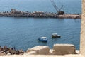 Passage way and fishermen near Citadel of Qaitbay, Egypt. Royalty Free Stock Photo