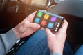 Passanger use mobile phone and app to help the driver find the desired location