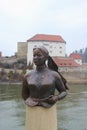 Bust of the poet and landlady Emerenz Meier on the quay of the Danube river in Passau, Germany.