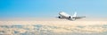 Passenger aircraft cloudscape with white airplane is flying in the daytime sky overcast, panorama view. Royalty Free Stock Photo