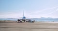 Passenger aircraft jet pushback transporting big plane using Towbarless tractor by airport personnel in Palma de Mallorca Airport Royalty Free Stock Photo