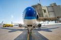 Passenger aircraft parked at the gangway at the airport at the refueling before the flight. Royalty Free Stock Photo