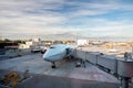 A passenger aircraft from the telescopic gangway to the airport. Royalty Free Stock Photo