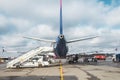 Passenger aircraft, waiting for the passengers to board at the airport terminal Royalty Free Stock Photo