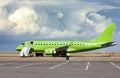 Passenger airliner at the airport during maintenance by technicians. Preflight preparation. Photography.