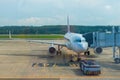 The passenger airliner arranges passengers through the sleeve Royalty Free Stock Photo