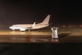 Passenger airplane on airport runway - night shot Royalty Free Stock Photo