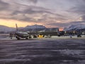 Passenger airplane arriving at arctic airport - Norway 15:30PM Royalty Free Stock Photo