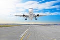 Passenger airplane the asphalt landing on a runway airport. Royalty Free Stock Photo