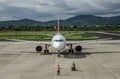 A passenger airplane docking at the airport Royalty Free Stock Photo