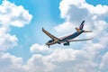 Passenger airplane flying above clouds Royalty Free Stock Photo