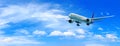 Passenger airplane flying above clouds. View from the window plane to amazing sky with beautiful clouds. Royalty Free Stock Photo