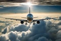 Passenger airplane flying above clouds. View from the window plane to amazing sky with beautiful clouds. Royalty Free Stock Photo