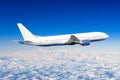 Passenger airplane flying travel, trip at flight level over the white clouds. Royalty Free Stock Photo