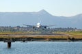 Passenger airplane landing on Corfu airport Royalty Free Stock Photo