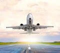 Passenger airplane landing and missed approach go around at sunset on a runway. Royalty Free Stock Photo