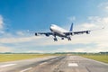 Passenger airplane is landing runway from airport morning flight Royalty Free Stock Photo