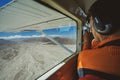 The passenger on the airplane and looks over the famous Nazca Lines.