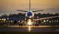 passenger airplane on runway at sunset