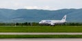 Passenger airplane Sukhoi Superjet 100 SSJ 100 of IrAero company on airfield