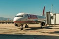 Passenger airplane and telescopic gangway in Palma international airport, Spain Royalty Free Stock Photo