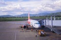 A passenger airplane of Vietjet Air docking at Lien Khuong Airport DLI in Dalat, Vietnam Royalty Free Stock Photo