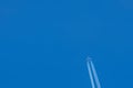 Passenger airplane. View exactly from below, silhouette against the blue sky. Royalty Free Stock Photo