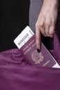 Passenger with boarding pass, passport and luggage Royalty Free Stock Photo