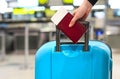 Passenger with boarding pass, passport and luggage Royalty Free Stock Photo