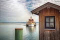 Passenger boat approaching a pier in Chiemsee lake, Bavaria, Germany