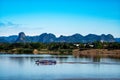 Passenger boats are ferrying between Thailand and Laos on the Mekong River. in Nakhon Phanom and Khammouane Province