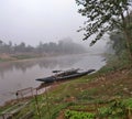 Passenger boats and riverbank gardens along the Namtha River in Luang Namtha, Laos