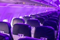 Passenger cabin of an empty plane. Economy class seats, blurred background. The flight is waiting for passengers to